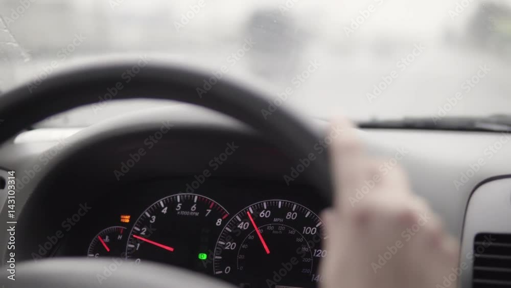 The car goes around the city in the rain. View from inside the cabin. 4K The car goes around the city in the rain. View from inside the cabin. 4K