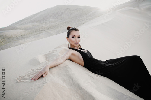Professional photo shoot of beautiful sexy asian woman in desert photo