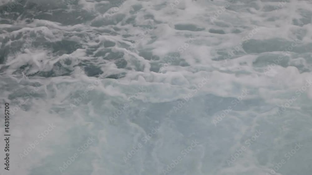 Boiling sea water. The water with whitecaps is boiling because of ship propeller.