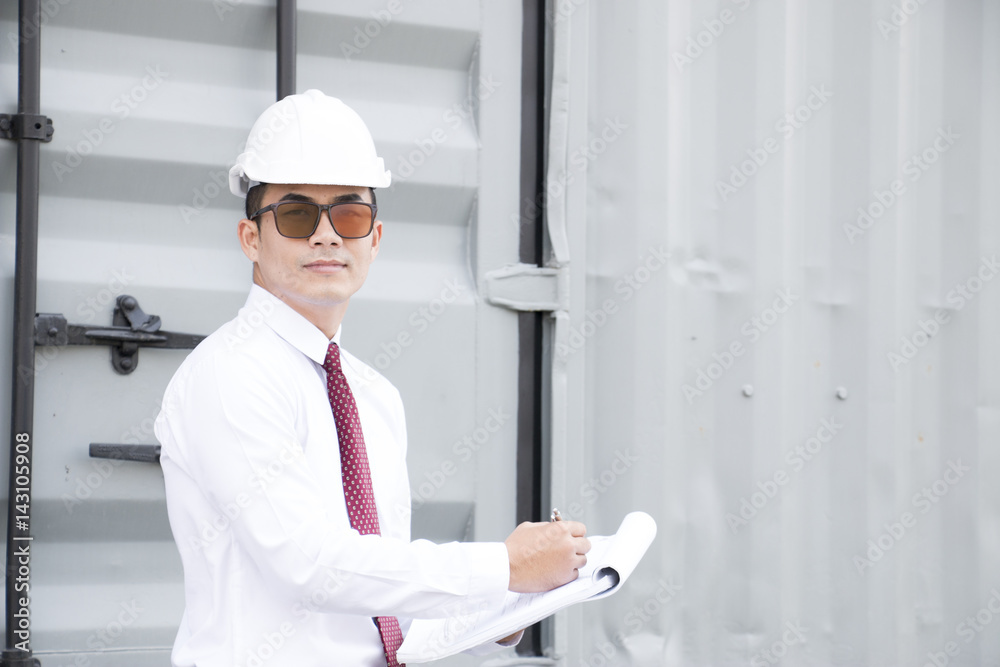 Engineer man wears safety hat and holding blur print Engineer man wears safety hat and holding blur print