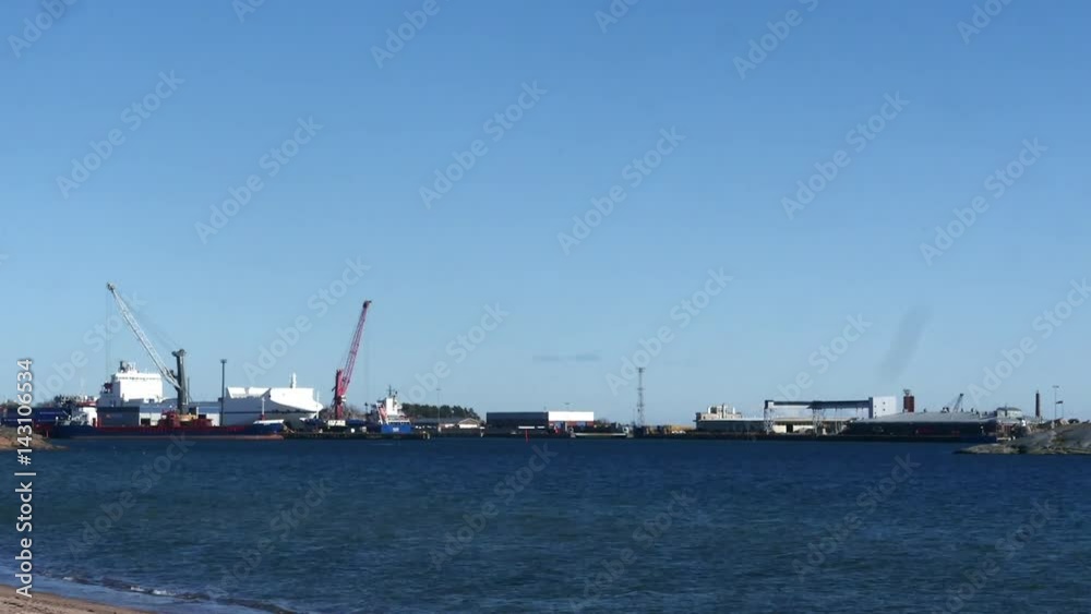 Hanko, Pan time lapse of cranes and ships at lansi-satama, filmed from tulliniemi beach, in Hanko, Finland Hanko, Pan time lapse of cranes and ships at lansi-satama, filmed from tulliniemi beach, in Hanko, Finland