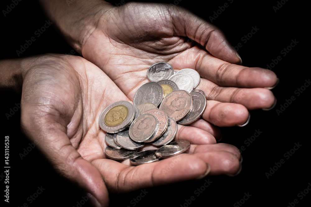 Closeup of Woman hand's holding Thai coins 