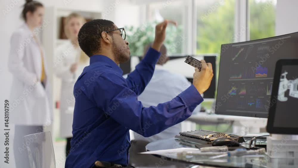  Scientific research engineers analyzing technical data with computer software