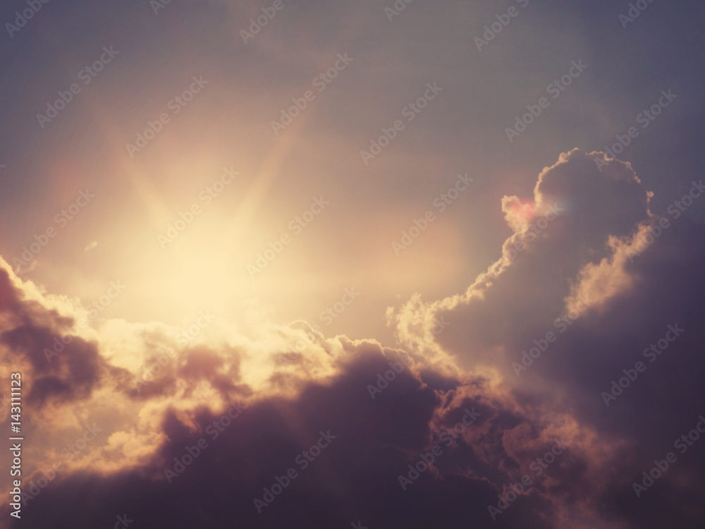 Abstract blurry nature background of sun behind grey clouds with soft style, vintage filter effect Abstract blurry nature background of sun behind grey clouds with soft style, vintage filter effect