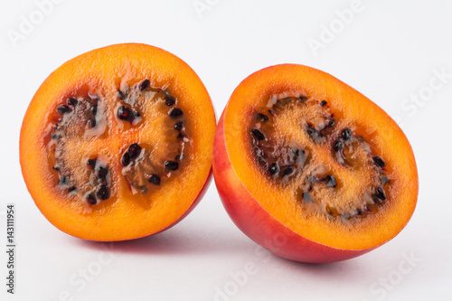 Exotic tropical fruit called tree tomato (Solanum Betaceum) on white background photo