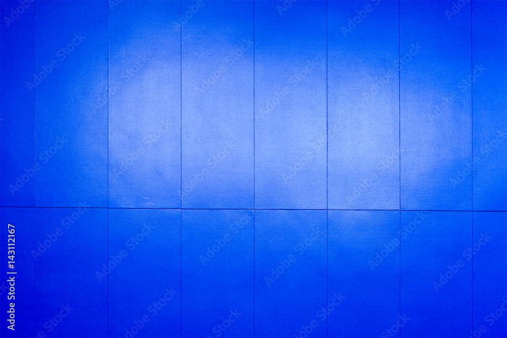 The dark blue concrete wall with the light The dark blue concrete wall with the light