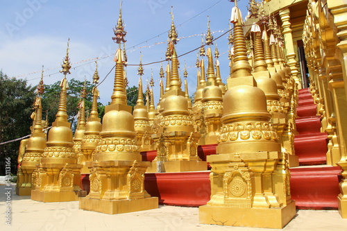 Golden pagoda in Wat Pasawangboon, Saraburi Province, Thailand photo