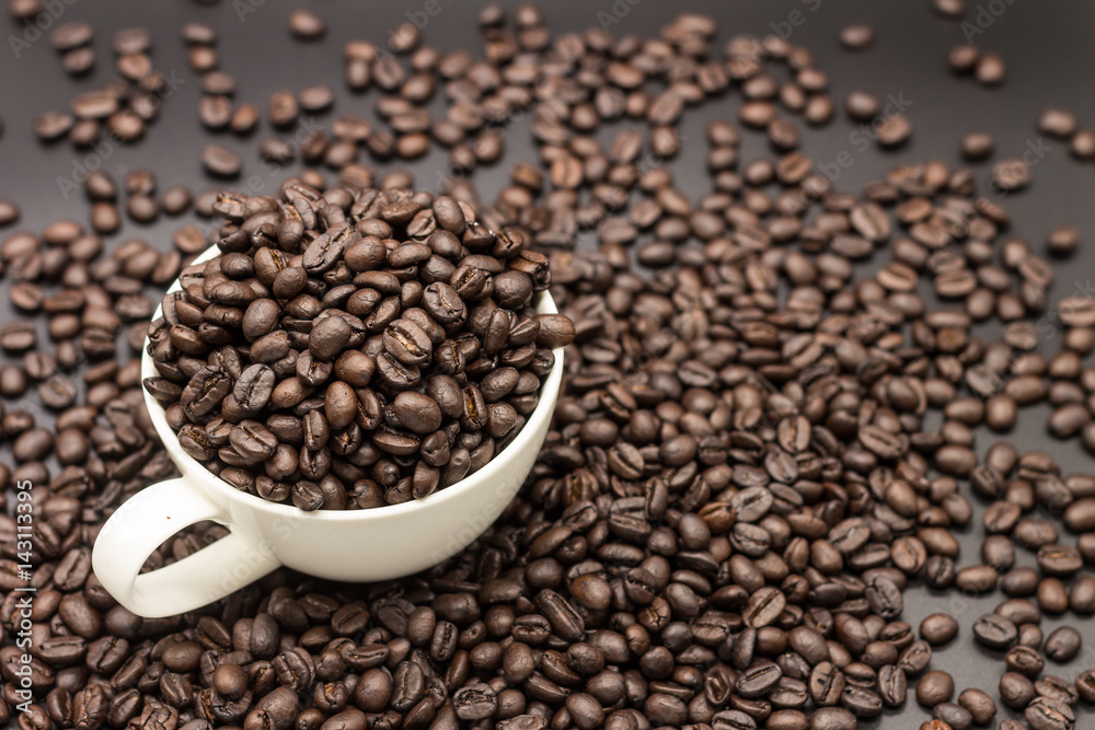 roasted coffee beans in white cup roasted coffee beans in white cup