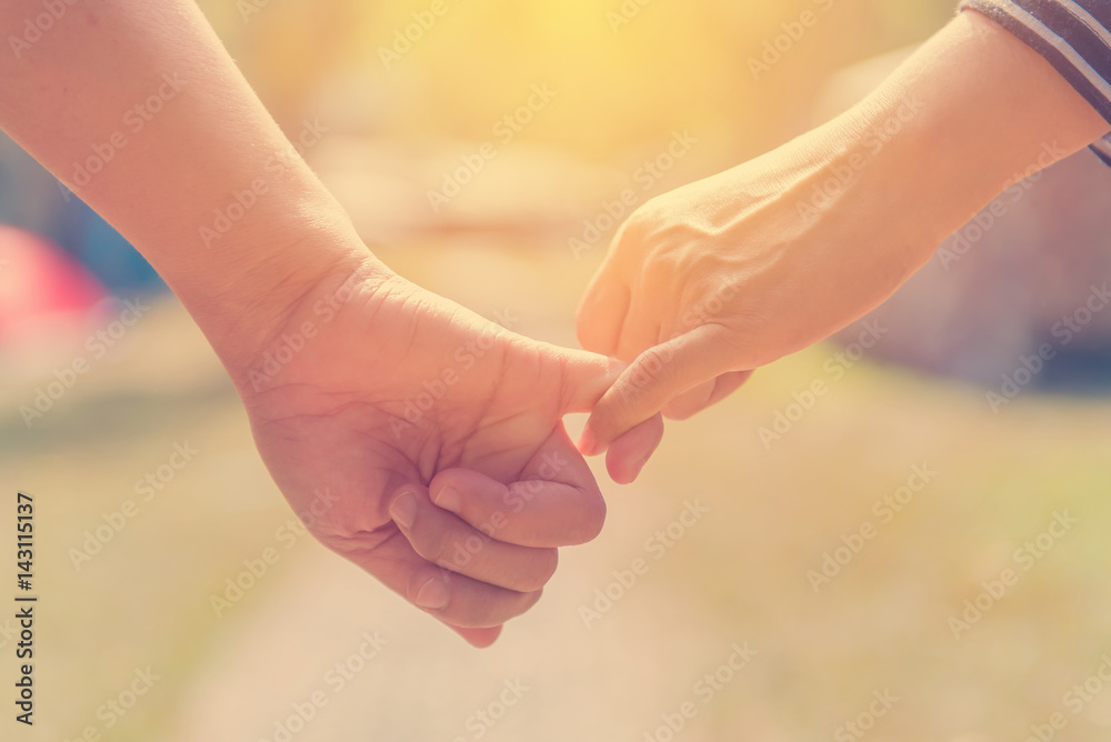 Happy couple holding hands together as forever love in Valentine day Happy couple holding hands together as forever love in Valentine day