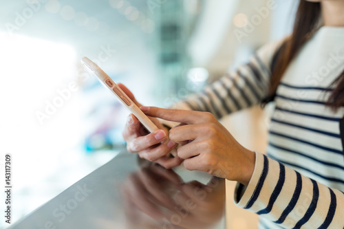 Woman working on smart phone
