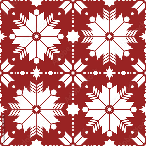 Vector seamless pattern of geometric snowflakes. Nordic pattern in Christmas traditional colors.