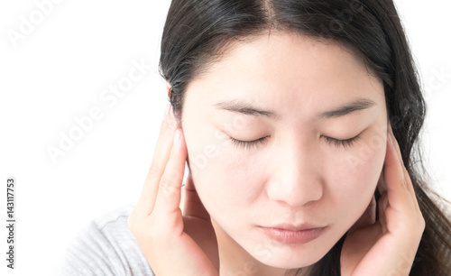 Closeup woman hand closes her ears with white background