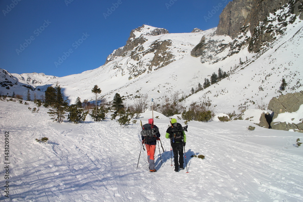Trekkers in Veľka Studená valley in High Tatras, Slovakia