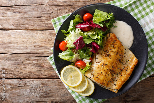 Photography Tasty roasted fish fillet Arctic char and fresh vegetables close-up