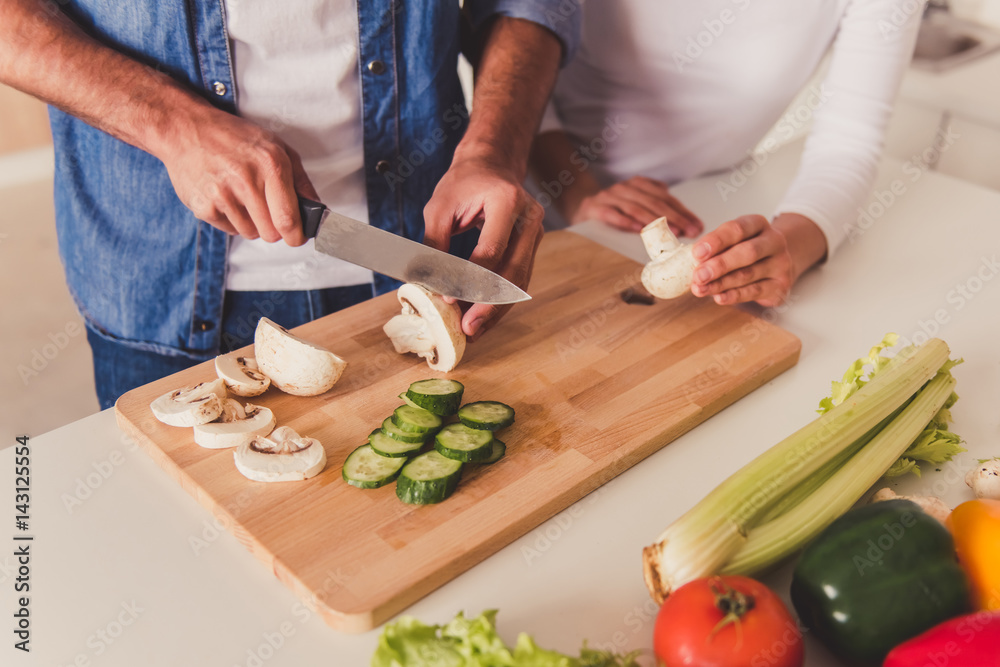 Beautiful couple cooking