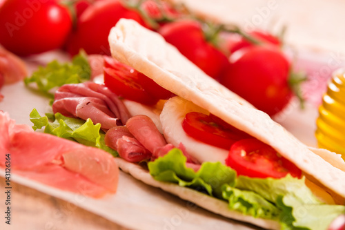 Piadina with ham and lettuce. 