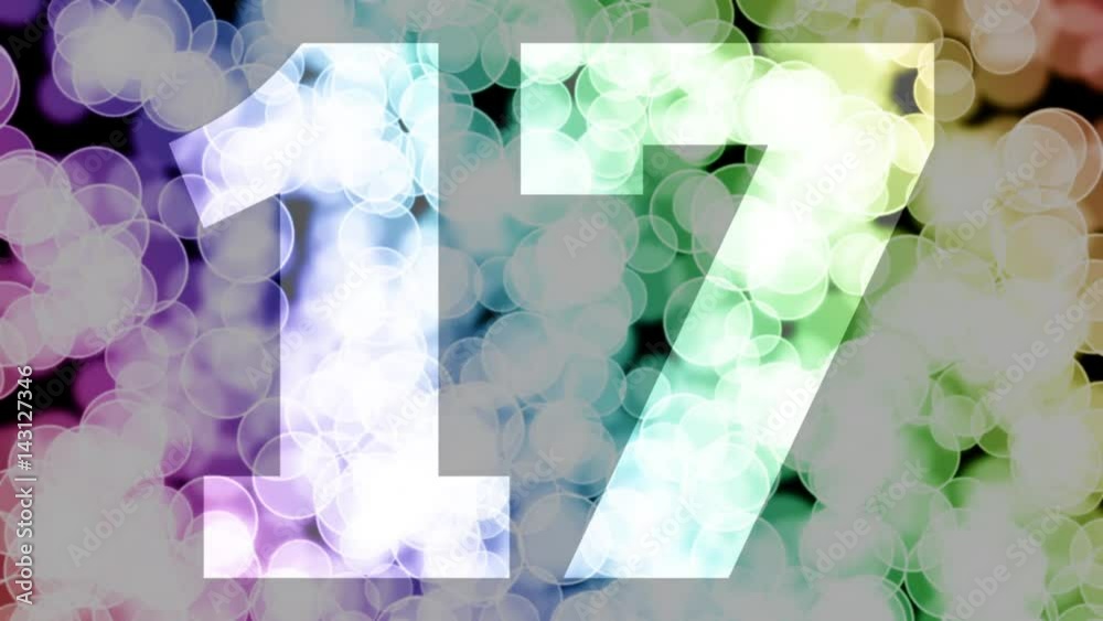 Seventeen to eighteen years birthday fade in/out animation with color gradient moving bokeh background. Animation: 90 frames still with number, 180 fade out, 30 clear, 180 fade in, 300 still.