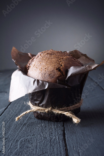 Chocolate cupcake on the table. Dark background. Place for text