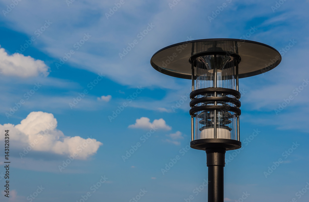 Outdoor modern lamp blue sky background .