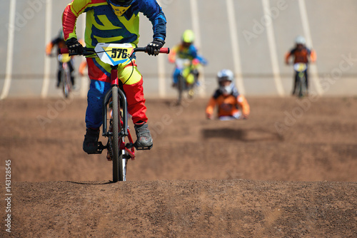 Fototapet BMX riders competing in the child class