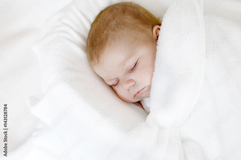 Cute little newborn baby girl sleeping wrapped in blanket Cute little newborn baby girl sleeping wrapped in blanket