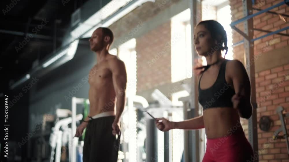 Young couple training with jump ropes Young couple training with jump ropes