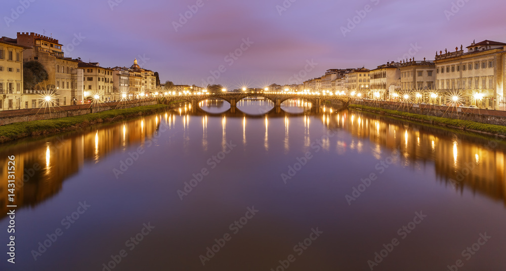 The Arno River flowing through Florence at sunrise.Italy