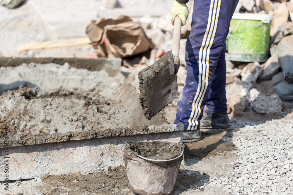 custom made wallpaper toronto digitalWorker with a bucket of concrete on a construction site
