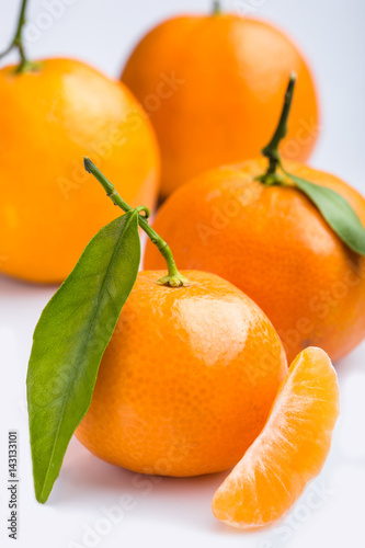 Ripe mandarin close-up on a white background. Tangerine orange. Colorful Food and drink still life concept. Fresh fruits. Clementine. Citrus. Diet. Vitamins. Healthy food.