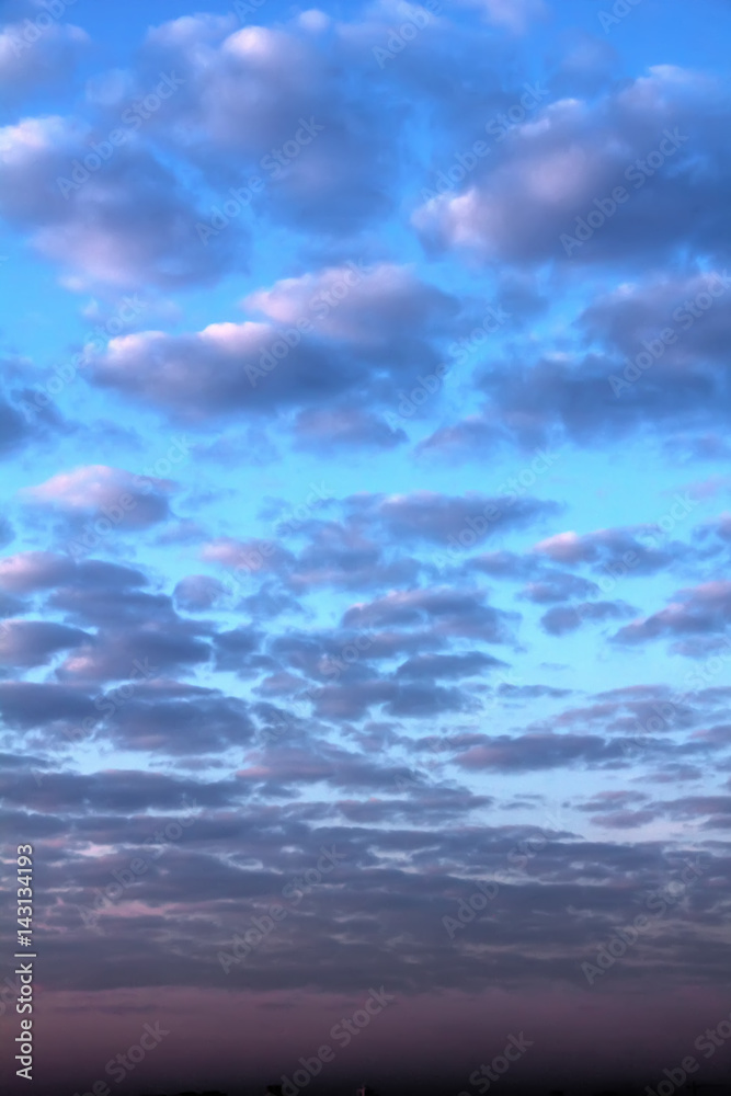 Dawn. Clouds. The clouds are colored by the rising sun.