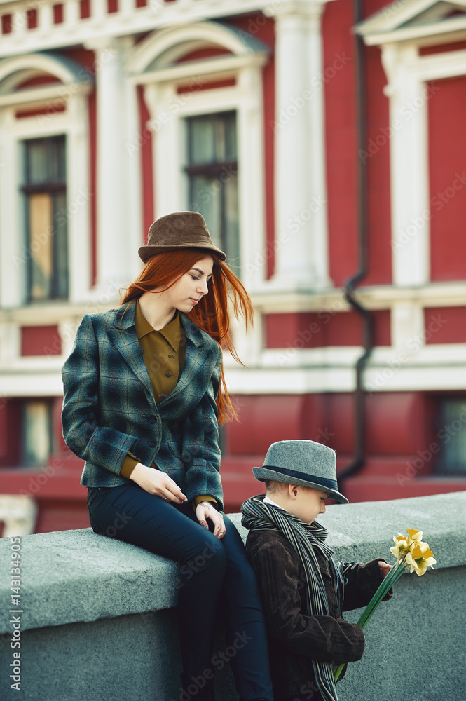 Brother sister and retro stylish clothes on the streets