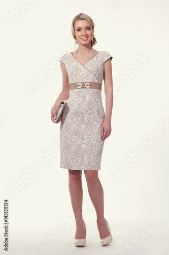 blond business woman in retro sleeveles lace dress photo