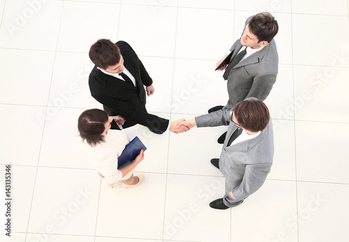Group of successful business people shaking hands. Top view.