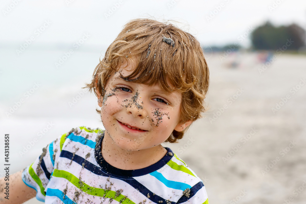 Little kid boy having fun on tropical beach Little kid boy having fun on tropical beach