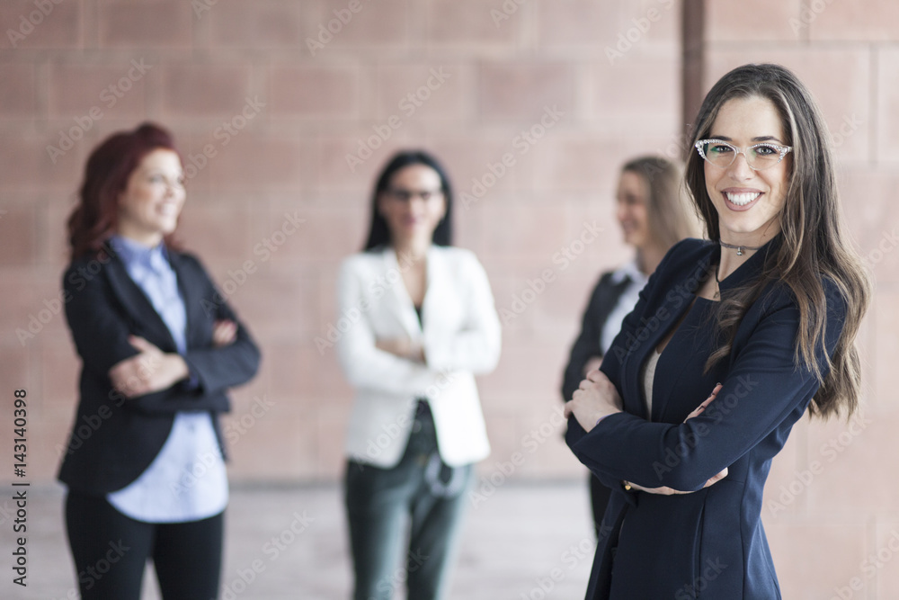 Successful smiling business woman leading a business group Successful smiling business woman leading a business group