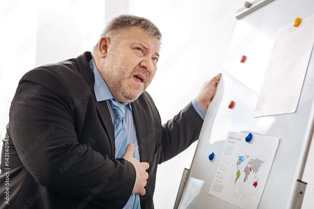 Exhausted office worker feeling anxious Exhausted office worker feeling anxious