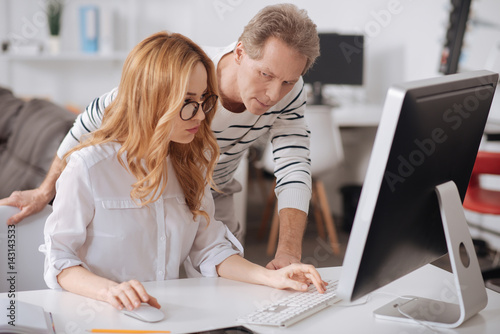 Involved business colleagues cooperating in the office