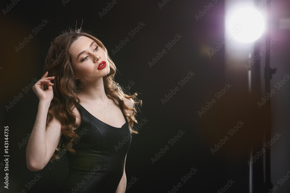 Beautiful seductive young woman with red lips standing and posing Beautiful seductive young woman with red lips standing and posing