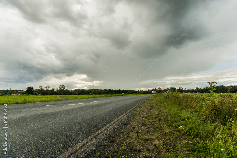Wheat fields. Sunny summer landscape. Beautiful massive clouds. Stormy clouds.