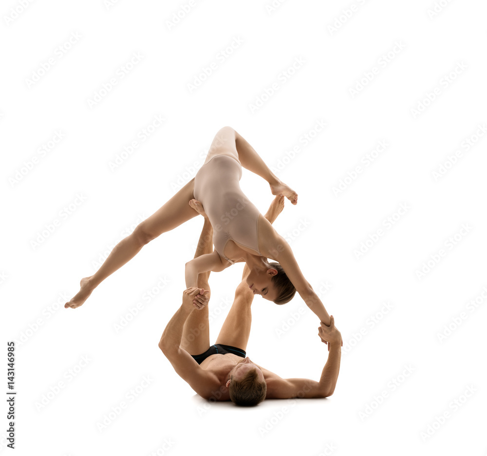 Young couple in sports clothes exercise in studio Young couple in sports clothes exercise in studio