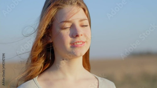 Portrait of a redhead girl at sunset photo