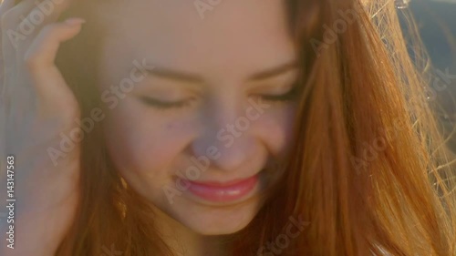 Portrait of a redhead girl at sunset photo