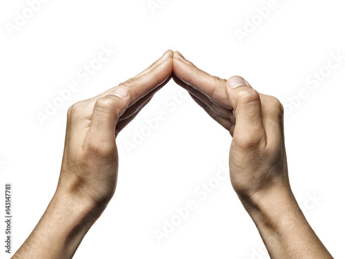 Two hands folded in a protective gesture. Isolated on white background. photo