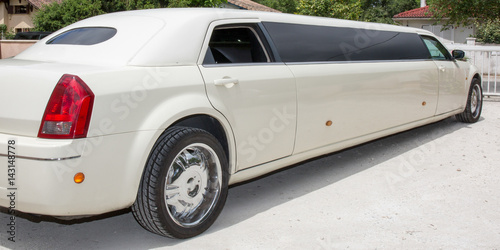 Rear view of a long white limousine car photo