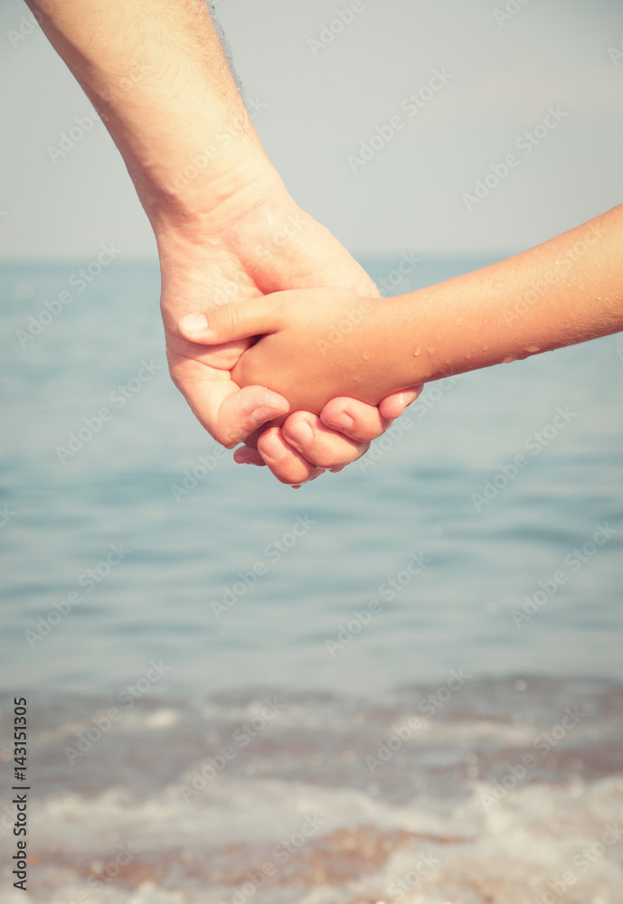 father holding  daughter hand