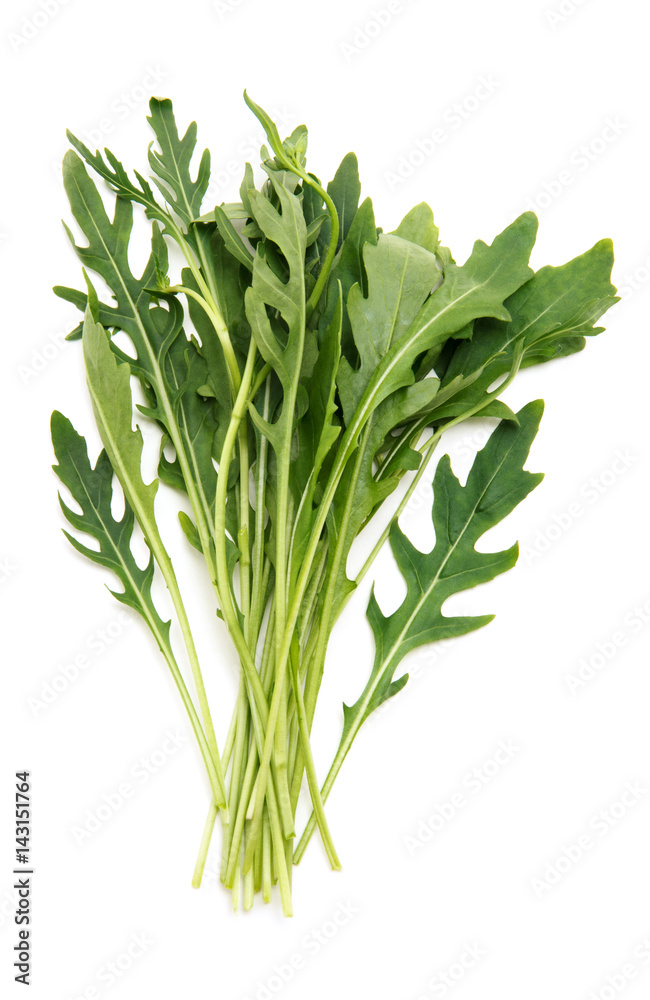 Fototapeta premium Fresh arugula leaves. Isolated on white background.