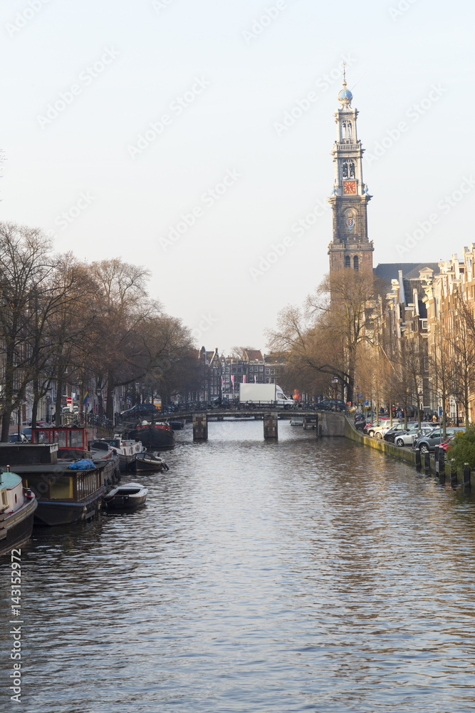 Amsterdam, March 16, 2017: Canals view from Amsterdam, where city of bikes, canals and peace