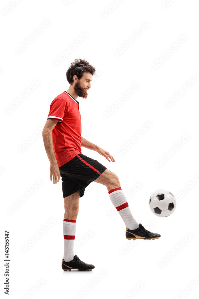 Bearded guy in a red jersey juggling a football