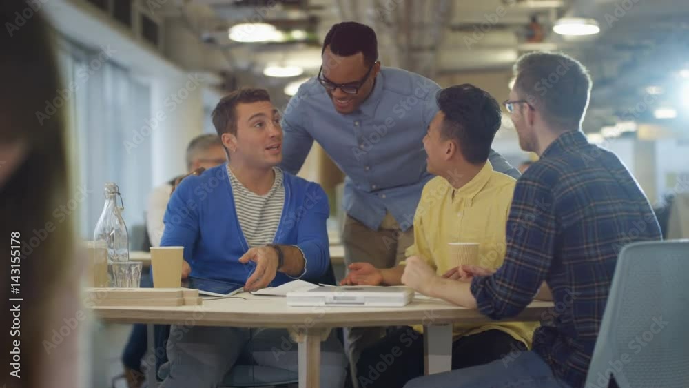 Casual business team brainstorming for ideas in office meeting Casual business team brainstorming for ideas in office meeting