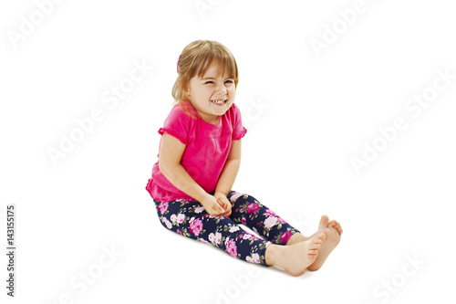 Little girl need a pee. Isolated on white background